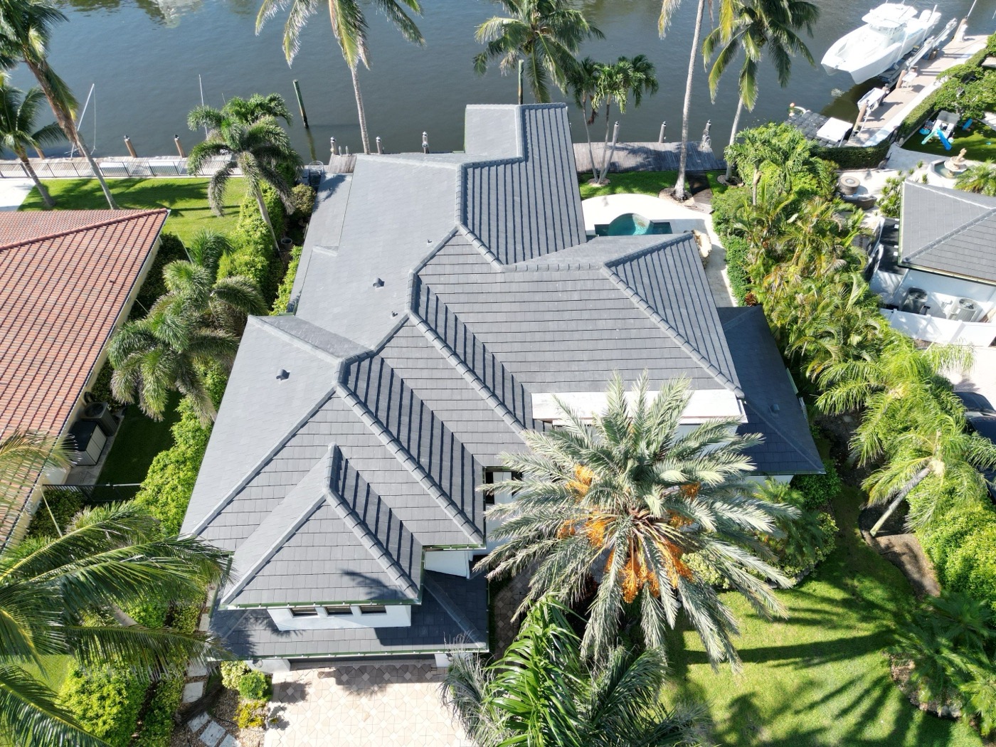 Finished flat tile roof with its eave and gutter line on an Intracoastal home