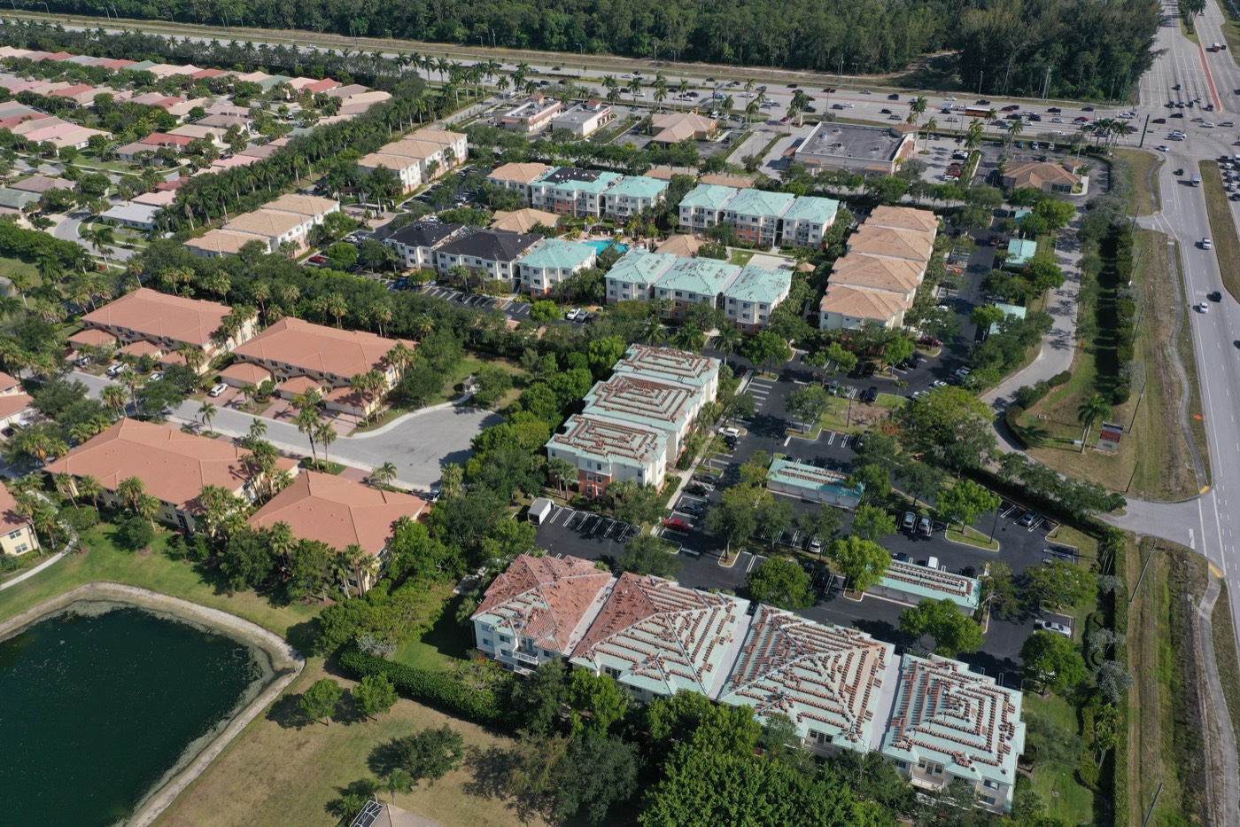 Multifamily property with tile and flat roof sections