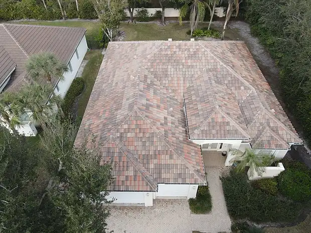 Top-down aerial of a home with a multicolor tile roof