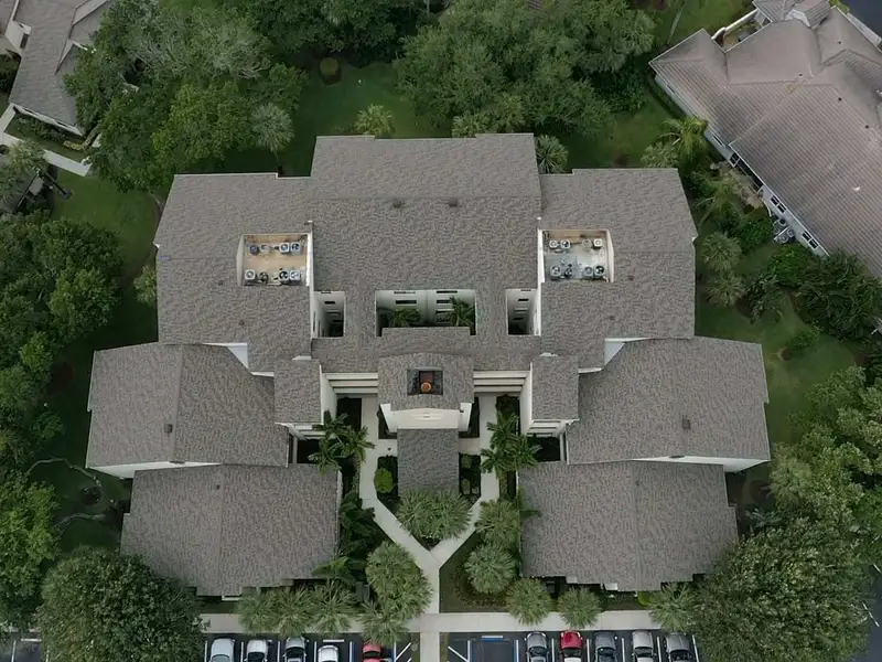 New grey shingle roof across an Oak Harbour building, courtyard below